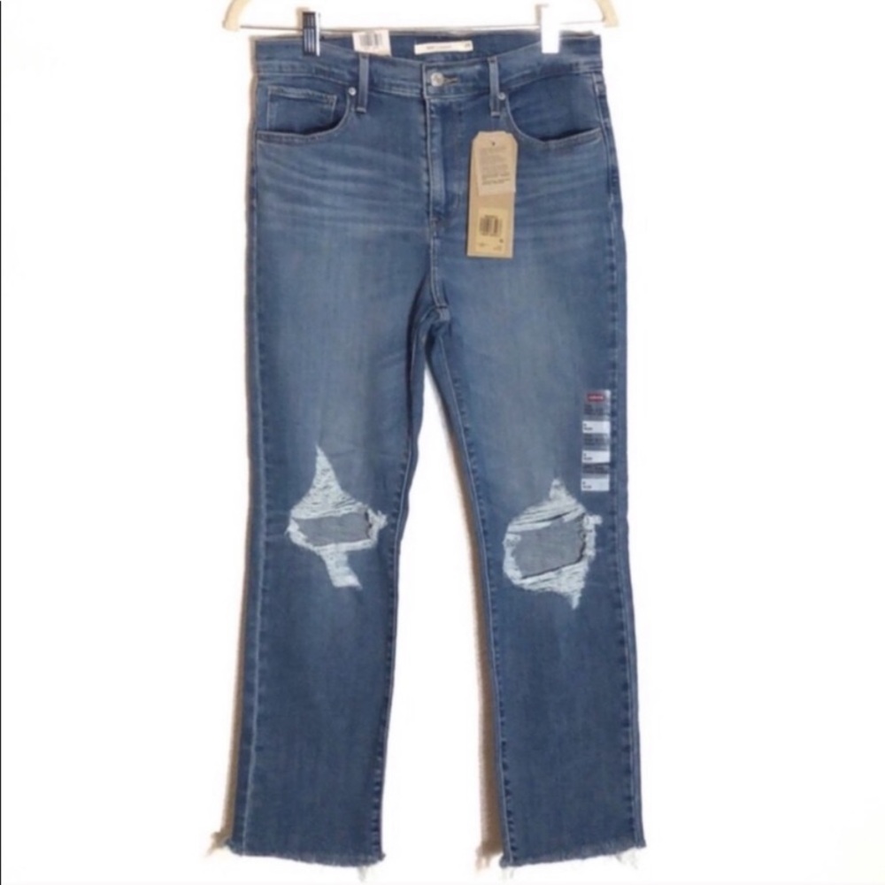 Levi’s distressed high rise raw hem jeans 29